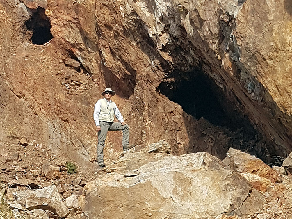 A man posing in front of La Colorado gold mine.